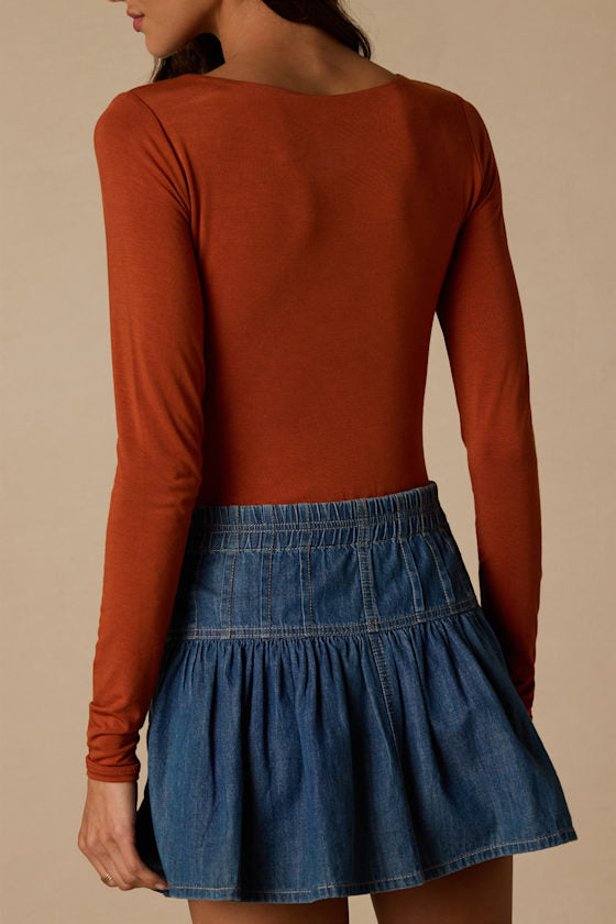 Easily Loved Rust Long Sleeve Bodysuit